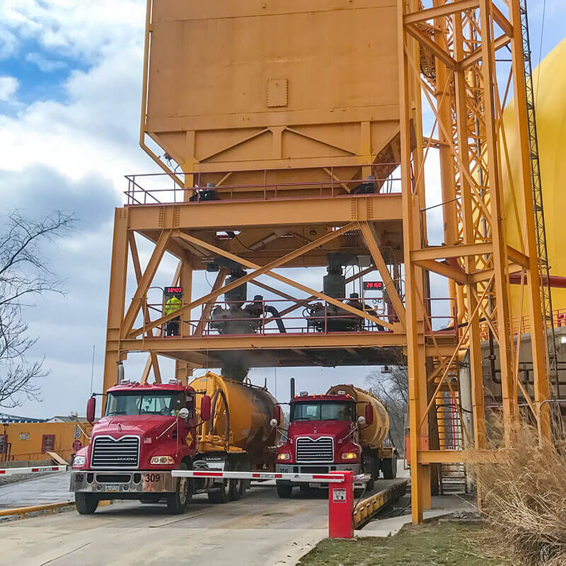 2 trucks loading loading dry bulk goods with Autohatch 